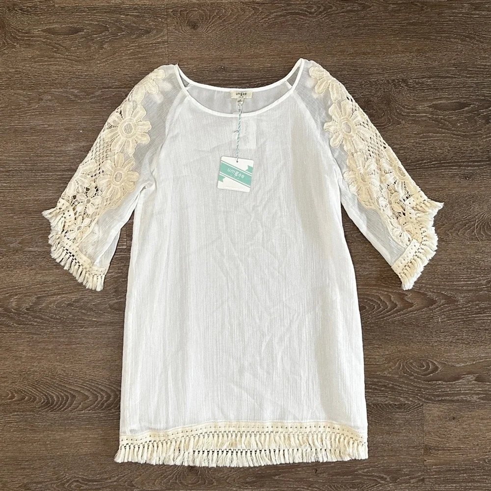 Umgee
Mini dress with floral crochet sleeves and fringe detail size S Small NWT - Picture 13 of 13